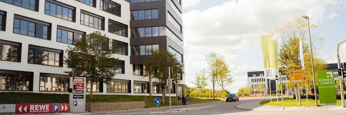 Main access road of the Business Campus Unterschleißheim with view of new office building